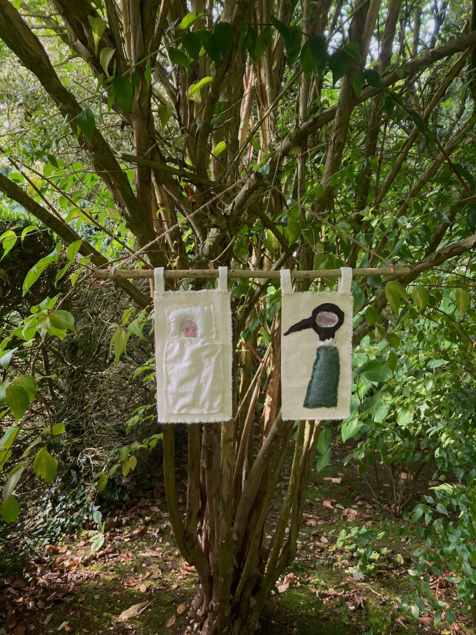Flagpole piece installed outdoors in tree branches, wider view