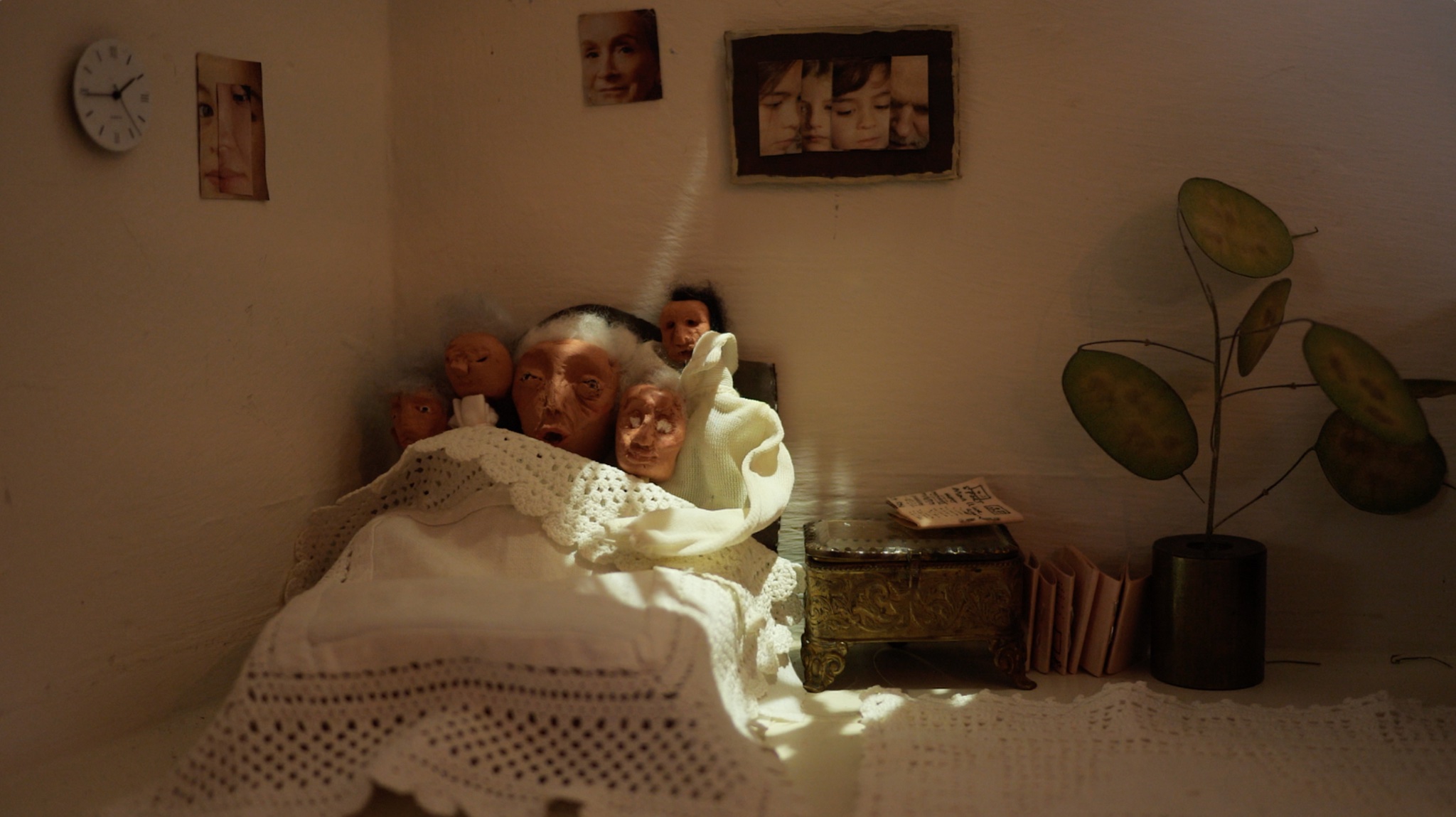 Still from Waiting Room showing puppet figures in a miniature bedroom set
